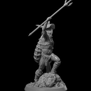 May include: A gray miniature figurine of a warrior figure, holding a trident overhead. The figure is clad in armor and stands atop a furry base. The warrior is posed in a dynamic stance, suggesting action. The background is black.