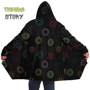 May include: Black hooded cloak with a colorful chakra pattern. The text "TWO SIDE STORY" is printed on the front of the cloak.