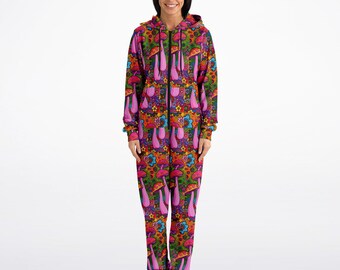 May include: A pink, orange, and green patterned onesie with a zipper closure and a hood. The pattern features mushrooms, flowers, and swirls.