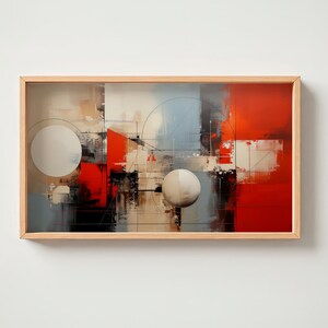Puede incluir: Impresión artística abstracta en un marco de madera natural. La obra presenta formas geométricas y pinceladas en rojo, negro, blanco y gris. Dos grandes círculos blanquecinos son prominentes, con líneas y rectángulos que crean una composición moderna.