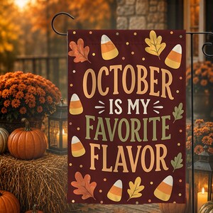 May include: A rectangular garden flag with a dark maroon background featuring the text OCTOBER IS MY FAVORITE FLAVOR in tan and light green. The design includes scattered illustrations of orange, yellow, and white candy corn and autumn leaves.