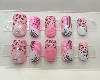 pink short square nails. cheetah/leopard print. handmade press ons. flowers. rhinestones. white and glitter. y2k. size small.