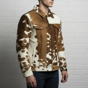 May include: A brown and white cowhide jacket with a classic collar, two chest pockets, and two side pockets. The jacket has a button-up front and cuffs. The sleeves and sides are a mix of brown and white patches.