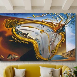 May include: A rectangular wall art print featuring a surrealist painting of a large, melting gold pocket watch with blue numerals. The watch face appears to be disintegrating into fragments against a dark brown and blue sky background.