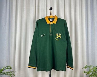 Camiseta polo de manga larga Nike de los Springboks de Sudáfrica, estilo rugbycore, ropa deportiva de estilo clásico, uniforme deportivo desgastado.