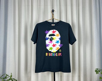 Camiseta vintage BAPE con cabeza de simio grande, estilo urbano japonés, con gráfico negro descolorido