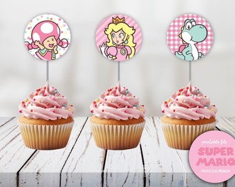 May include: Three pink cupcakes with colorful sprinkles topped with round printable cupcake toppers featuring characters from the Super Mario video game franchise. The toppers include Princess Peach, Yoshi, and Toad.