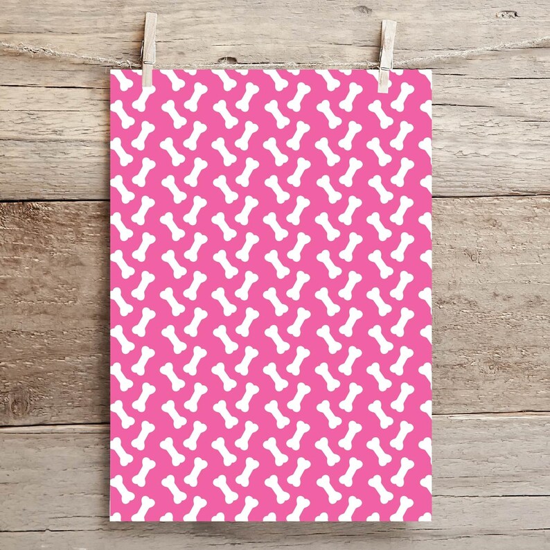 May include: Pink wrapping paper with a white bone pattern.