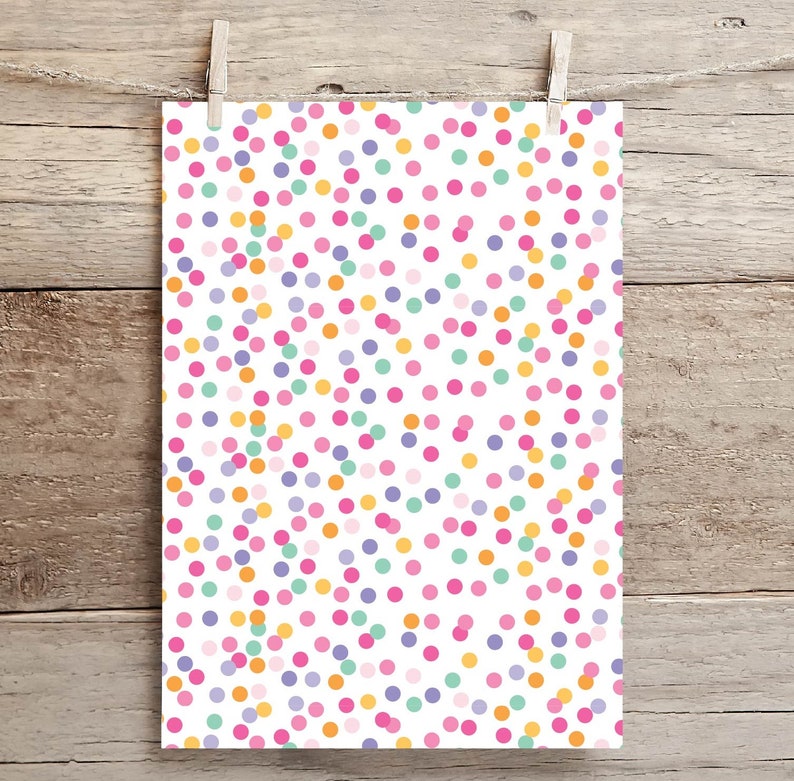 May include: White background with a repeating pattern of colorful polka dots. The dots are in shades of pink, orange, purple, and green.
