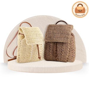 May include: Two woven rattan backpacks in beige and brown. The beige backpack has a drawstring closure and brown leather straps. The brown backpack has a flap closure and a top handle. Both bags are displayed on a white, circular platform.