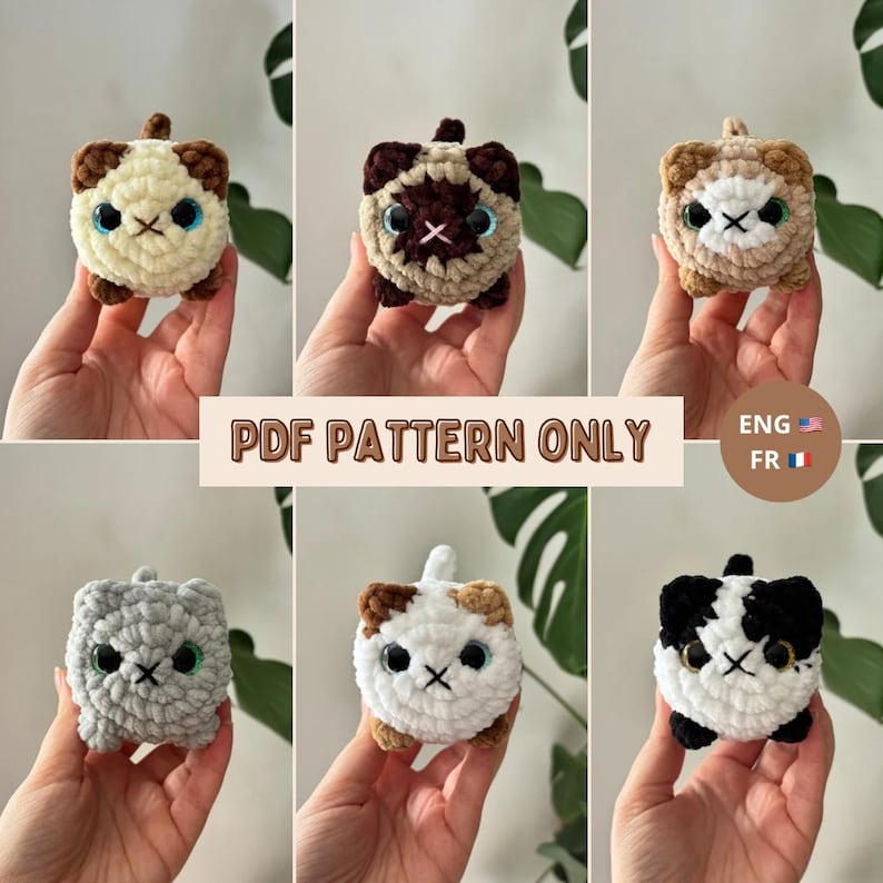 May include: A collection of six crocheted cat plushies in various colors, including cream, brown, gray, and black. Each plushie has a square body, embroidered facial features, and a small tail. The text "PDF PATTERN ONLY" is displayed.