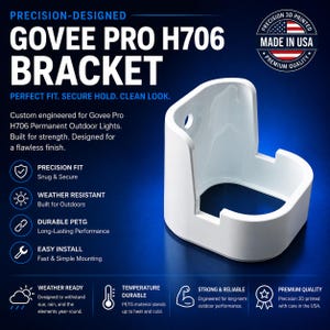 May include: A white, U-shaped mounting bracket for Govee Pro H706 permanent outdoor lights. The bracket features a circular screw hole on the back panel and a curved, open-front design. Text on the image includes Govee Pro H706 Bracket and Made in USA.