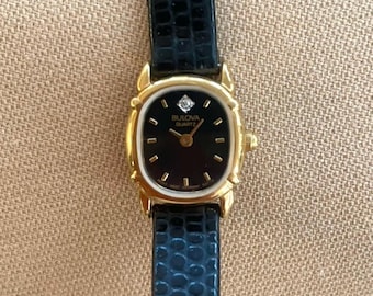 Vintage Bulova Women's Watch • Black & Gold, Diamond Accent, Leather Strap