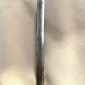 May include: A silver chain bracelet with a box clasp.