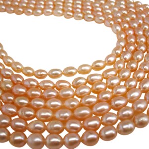 Peach Pearls Peach Color Freshwater Pearls Rice Shape SKU 4728 image 4