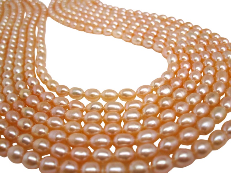 Peach Pearls Peach Color Freshwater Pearls Rice Shape SKU 4728 image 2