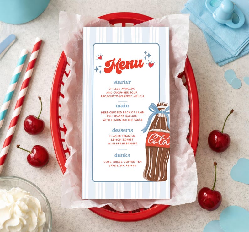 May include: A menu card with a blue and white striped design, featuring the word "Menu" in red script. The menu includes starters, main courses, desserts, and drinks. A red basket holds the menu, cherries, and straws.