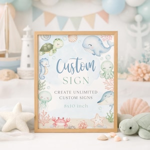 K&ouml;nnte beinhalten: Ein gerahmtes Schild mit hellem Holzrahmen zeigt ein Aquarelldesign von Meeresbewohnern. Auf dem Schild steht "Custom SIGN" und "CREATE UNLIMITED CUSTOM SIGNS". Das Schild ist 20,3 x 25,4 cm gro&szlig;.
