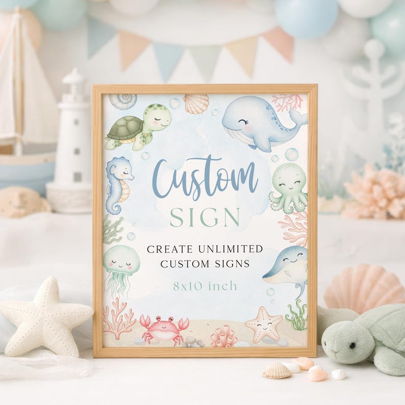 K&ouml;nnte beinhalten: Ein gerahmtes Schild mit hellem Holzrahmen zeigt ein Aquarelldesign von Meeresbewohnern. Auf dem Schild steht "Custom SIGN" und "CREATE UNLIMITED CUSTOM SIGNS". Das Schild ist 20,3 x 25,4 cm gro&szlig;.