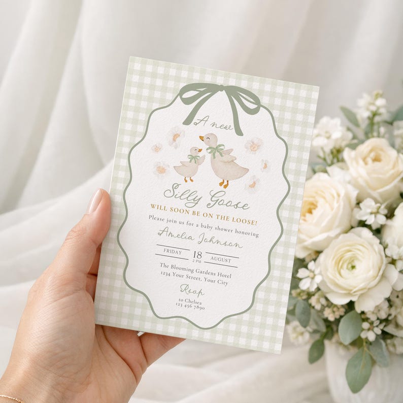 May include: A baby shower invitation featuring a light green gingham pattern background. The invitation has a scalloped border with a watercolor illustration of two geese. The text reads "A new Silly Goose will soon be on the loose!" and includes event details.