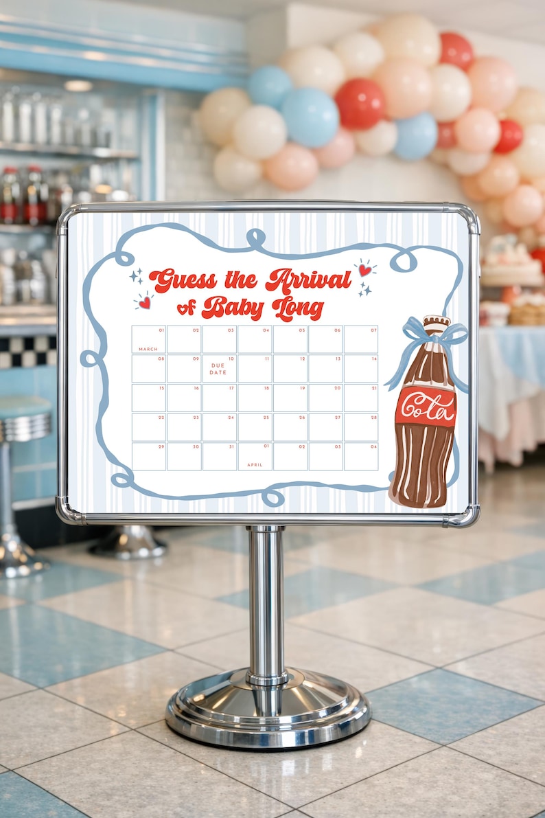 May include: A white sign with a calendar grid and the text "Guess the Arrival of Baby Long." A brown soda bottle illustration with a blue bow is on the right. The sign is on a silver stand.