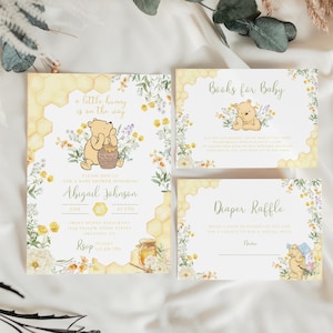 May include: Baby shower invitation set featuring Winnie the Pooh illustrations and honeycomb designs. The invitation includes the text "a little hunny is on the way" and details for Abigail Johnson's baby shower. Additional cards include "Books for Baby" and "Diaper Raffle".