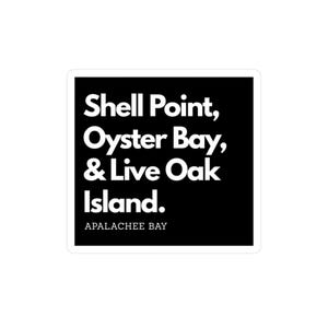 Peut inclure: Un autocollant carré avec un fond noir et du texte blanc. Le texte indique "Shell Point, Oyster Bay, & Live Oak Island." En dessous, en plus petit, il est écrit "Apalachee Bay."