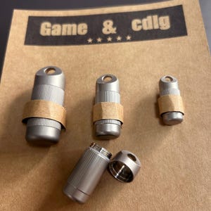 Three sizes of titanium alloy waterproof pill boxes, high-quality keychain pendants