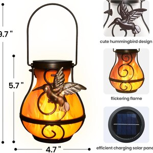 May include: Solar-powered outdoor lantern with a hummingbird design. The lantern is 9.7 inches tall, 5.7 inches wide, and 4.7 inches deep. It features a flickering flame effect and an efficient charging solar panel. The lantern has a handle for easy carrying.