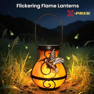 May include: A solar-powered lantern with a flickering flame effect, featuring a decorative hummingbird. The lantern has a black metal frame and a handle for hanging. The text "Flickering Flame Lanterns" and the brand name "X-PREK" are visible.