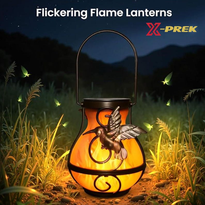 May include: A solar-powered lantern with a flickering flame effect, featuring a decorative hummingbird. The lantern has a black metal frame and a handle for hanging. The text "Flickering Flame Lanterns" and the brand name "X-PREK" are visible.