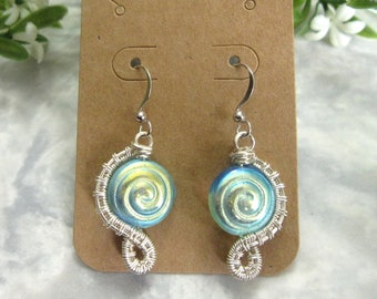 Iridescent blue pattern glass beads and silver coloured wire earrings with nickel free ear wires