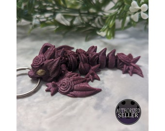 Ready to ship, assorted colours of rose dragon keychain fidget toy made using articulated 3d printed Cinderwing3d design