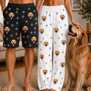 May include: Black shorts and white lounge pants featuring a repeating pattern of golden retriever faces and grey paw prints. The shorts have an elastic waistband, and the lounge pants are full-length with a matching elasticized waist design.