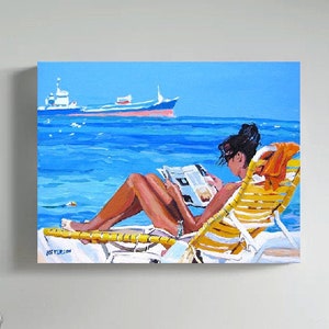 May include: A woman in a yellow and white striped beach chair reads a magazine on a sunny beach. A blue and white ship sails in the distance.