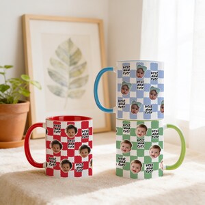 May include: Three ceramic mugs with the text "best dad ever" and baby faces. One mug has a red and white checkered pattern with a red handle. The other two mugs have blue and green checkered patterns with blue and green handles.