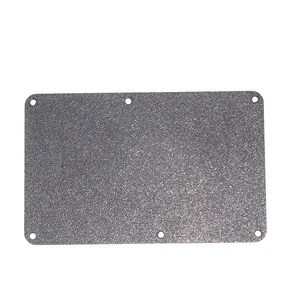 May include: A silver metal plate with a textured surface and four holes around the edges.