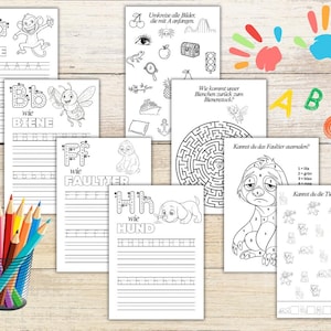 May include: A collection of educational activity sheets for children featuring alphabet practice pages with animals, a maze, a color-by-number sloth, and a counting exercise, accompanied by a wire cup filled with colored pencils and letter cutouts.