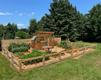 May include: A wooden garden shed with a glass roof and a wooden fence surrounding a garden with multiple raised beds.