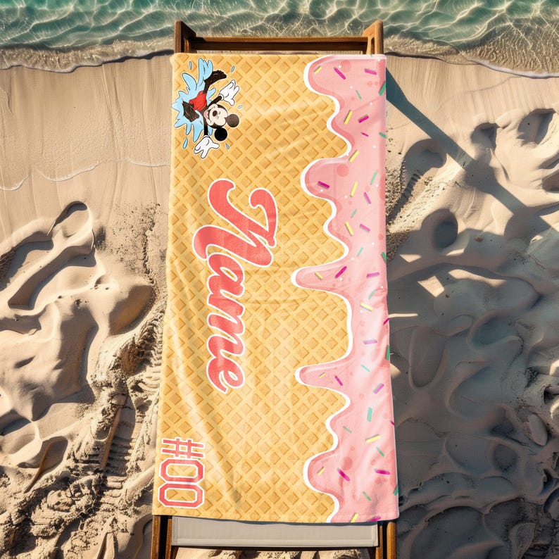 May include: A yellow and pink beach towel with a waffle pattern and a pink ice cream drip design. The towel has a cartoon image of Mickey Mouse and the text "Name #00".