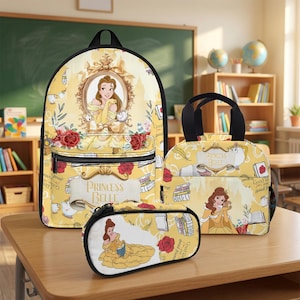May include: A yellow backpack, lunch bag, and pencil case set featuring Princess Belle from Beauty and the Beast. The items display illustrations of Belle, red roses, books, and the text Princess Belle on a light yellow background with black trim.