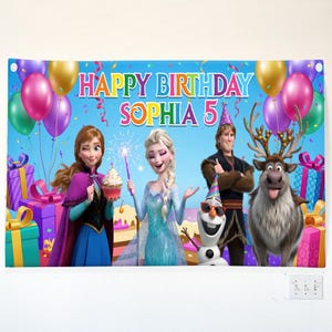 May include: A blue birthday banner featuring characters from the movie Frozen, with the text "HAPPY BIRTHDAY SOPHIA 5". The banner includes images of Anna, Elsa, Olaf, Kristoff, and Sven, along with balloons and wrapped gifts.