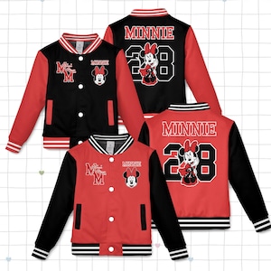 May include: Red and black varsity jackets featuring Minnie Mouse. The jackets have a white and black striped collar, cuffs, and hem. The front of the jacket has the letter "M" and a Minnie Mouse patch. The back of the jacket has the word "MINNIE" and the number "28".