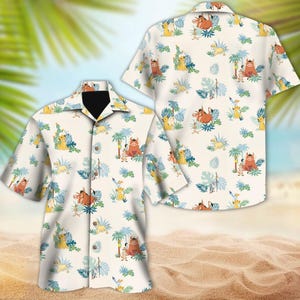 May include: A white button-up shirt with a tropical print featuring cartoon characters from the movie The Lion King. The print includes Simba, Pumbaa, Timon, and other jungle animals.