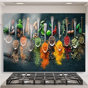May include: A decorative kitchen wall art piece featuring a collection of silver spoons filled with various colorful spices and herbs. The spices are arranged in a vibrant, eye-catching display against a dark background, creating a visually appealing culinary theme.