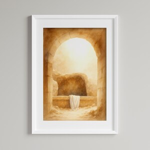 Op de afbeelding: Aquarel schilderij van een leeg graf met helder licht dat uit de opening komt. Het kunstwerk, omlijst in wit, toont een boogvormige ingang en een witte doek over een stenen richel, wat vrede en spiritualiteit oproept.