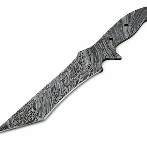 May include: A Damascus steel knife with a wavy, marbled pattern. The blade is sharp and pointed, with a curved handle featuring three holes. The knife has a dark, metallic appearance and is set against a white background.