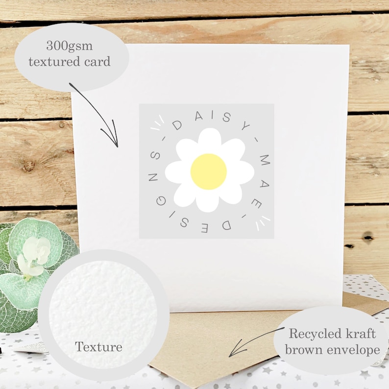 May include: A white greeting card with a textured surface, featuring a daisy logo and the text "DAISY MAE DESIGN". Includes a recycled kraft brown envelope. The card is made of 300gsm textured card.