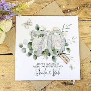 May include: A handmade wooden sign with the word "Welcome" in a whimsical font. The sign has a distressed white background and a dark brown frame, ideal for a front door or hallway. The sign measures approximately 30 cm wide and 15 cm tall.