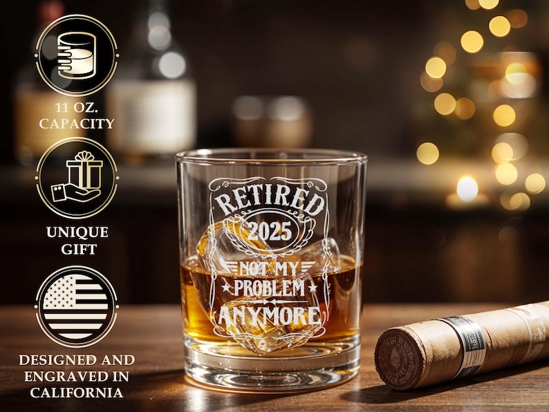 May include: A clear glass tumbler with the text "RETIRED 2025 NOT MY PROBLEM ANYMORE" etched on the front. The glass is filled with amber liquid and ice. The glass has an 11 oz capacity. The design is engraved in California.